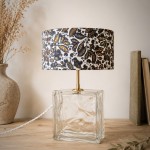Lampe vintage en pavé de verre lumineux et abat-jour fleuri bleu artisanal.